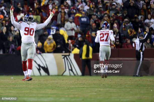 Defensive end Jason Pierre-Paul of the New York Giants celebrates after the defense scored a touchdown on an interception against the Washington...