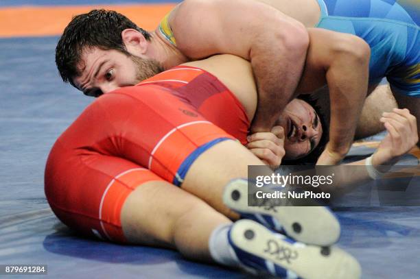 Japans T. Sonoda competes with Ukraines M. Mchedlidze during the Senior U23 Wrestling World Championships in the 97 kg class on November 26, 2017 in...