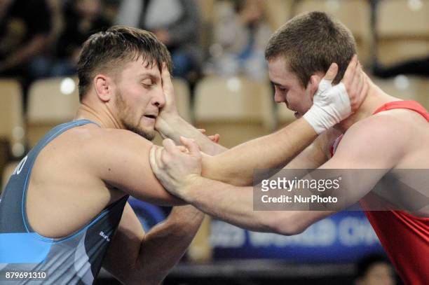 Belaruss D. Khramiankou competes with Polands A. Wojtachnio during the Senior U23 Wrestling World Championships in the 97 kg class on November 26,...