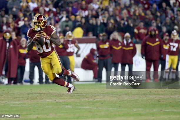 Wide receiver Jamison Crowder of the Washington Redskins rushes with the ball after catching a pass against the New York Giants at FedExField on...