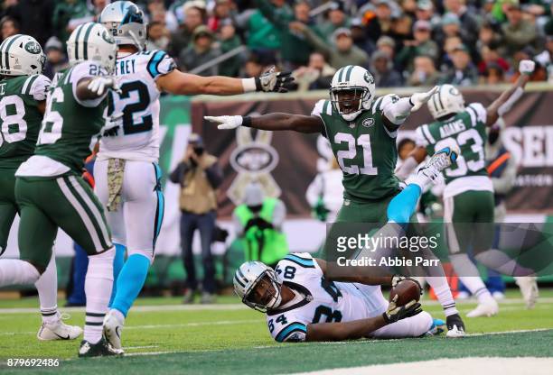 Cornerback Morris Claiborne of the New York Jets reacts after a tackle on tight end Ed Dickson of the Carolina Panthers during the second half of the...