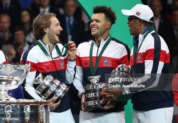 Lucas Pouille, Jo-Wilfried Tsonga, captain of France Yannick Noah celebrate winning the Davis Cup during the trophy presentation on day 3 of the...