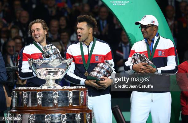 Lucas Pouille, Jo-Wilfried Tsonga, captain of France Yannick Noah celebrate winning the Davis Cup during the trophy presentation on day 3 of the...