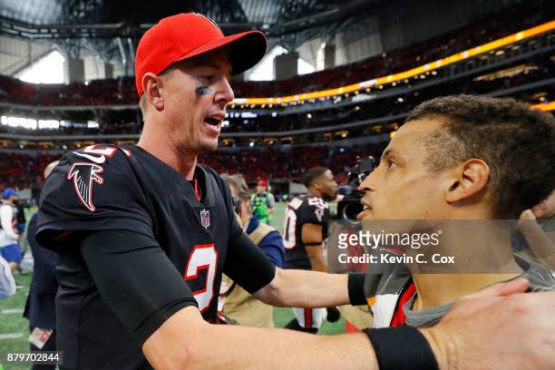 Matt Ryan of the Atlanta Falcons talks to Brent Grimes of the Tampa Bay Buccaneers after the game at Mercedes-Benz Stadium on November 26, 2017 in...