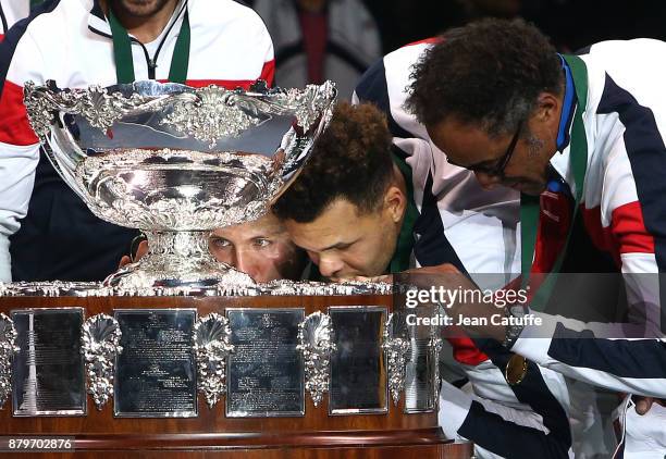 Lucas Pouille, Jo-Wilfried Tsonga, captain of France Yannick Noah celebrate winning the Davis Cup during the trophy presentation on day 3 of the...