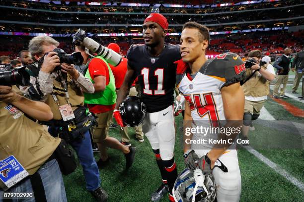 Julio Jones of the Atlanta Falcons talks to Brent Grimes of the Tampa Bay Buccaneers after the game at Mercedes-Benz Stadium on November 26, 2017 in...