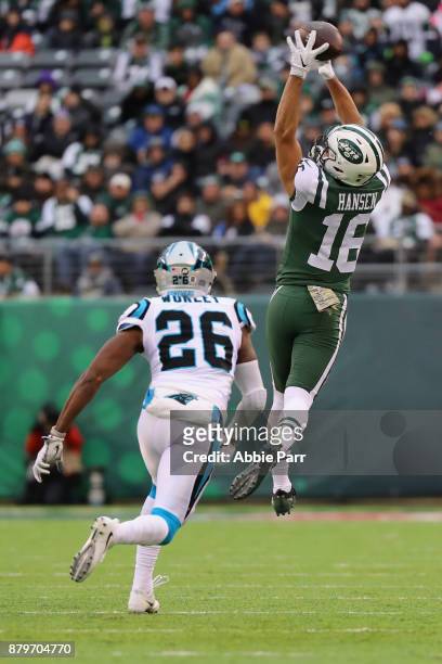 Wide receiver Chad Hansen of the New York Jets makes a catch over cornerback Daryl Worley of the Carolina Panthers during the third quarter of the...
