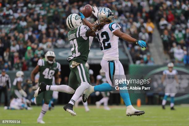Wide receiver Kaelin Clay of the Carolina Panthers attempts to make a catch over cornerback Morris Claiborne of the New York Jets during the third...