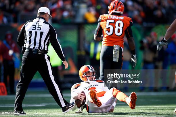 Cody Kessler of the Cleveland Browns reacts after being sacked by Carl Lawson of the Cincinnati Bengals in the first half of a game at Paul Brown...