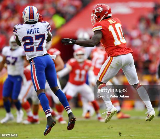 Cornerback Tre'Davious White of the Buffalo Bills intercepts a pass in front of wide receiver Tyreek Hill of the Kansas City Chiefs to seal the game...