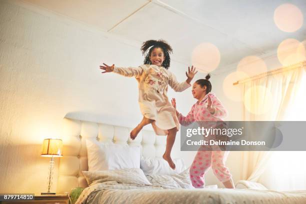 beds are made for jumping - sleep over stock pictures, royalty-free photos & images