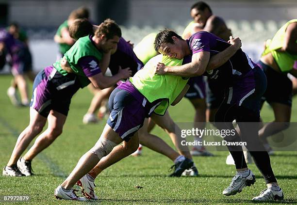 Storm players perform tackling drills during a Melbourne Storm NRL training session at Visy Park on May 26, 2009 in Melbourne, Australia.
