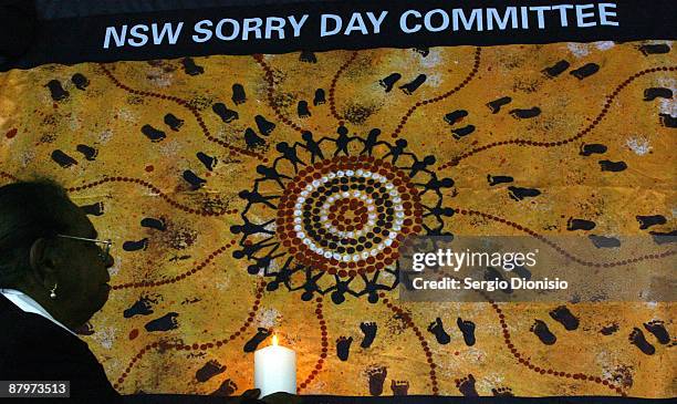 Leilla Wenberg a member of the Stolen Generation removed from her parents car at 6 months of age, holds a candle during a National Sorry Day...