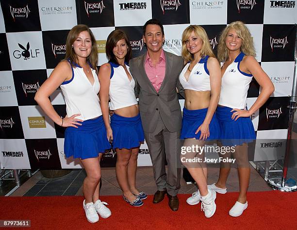 Television/Radio Personality Carlos Diaz poses with the Girls of Playboy Golf for a photo on the red carpet at an post Indy 500 race party at The...