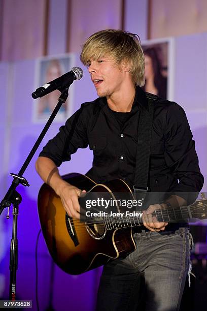 Derek Hough of The Ballas-Hough band performs onstage inside the Indy 500 race after party at The Conrad Hotel on May 24, 2009 in Indianapolis,...
