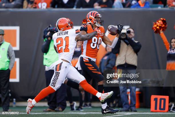 Josh Malone of the Cincinnati Bengals tries to make a one-handed catch against Jamar Taylor of the Cleveland Browns in the second half of a game at...