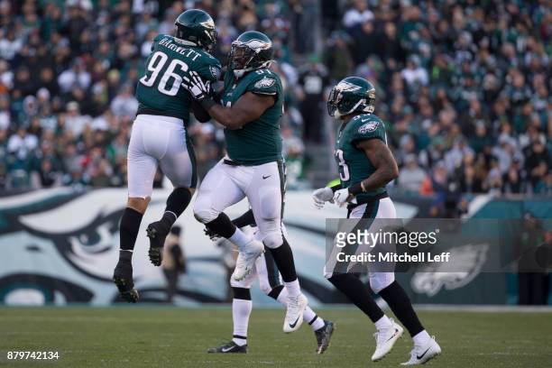 Fletcher Cox of the Philadelphia Eagles celebrates after a sack with Derek Barnett and Nigel Bradham in the fourth quarter against the Chicago Bears...
