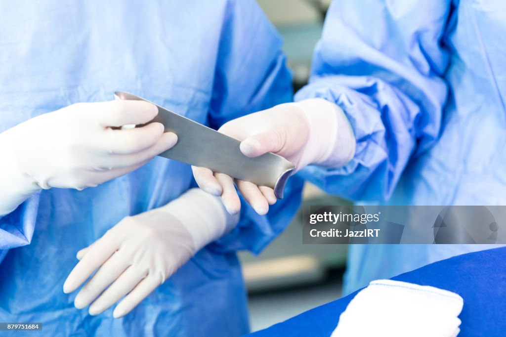 Doctor Operating Tools Handing Doctor Surgical Tool In Operating Room High-Res Stock Photo ...