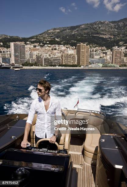 Formula 1 racing driver Jenson Button poses for a portrait shoot in Monte Carlo for Live Night & Day magazine, May 5, 2009.