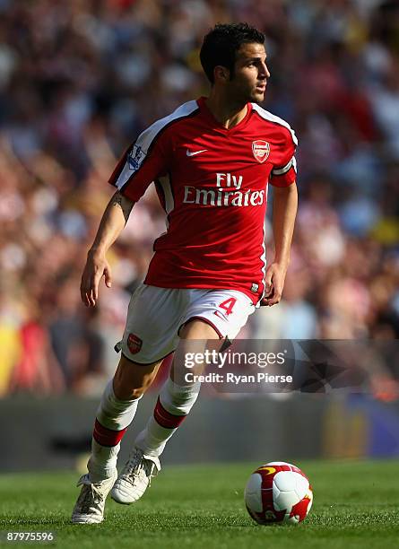 Cesc Fabregas of Arsenal runs with the ball during the Barclays Premier League match between Arsenal and Stoke City at Emirates Stadium on May 24,...