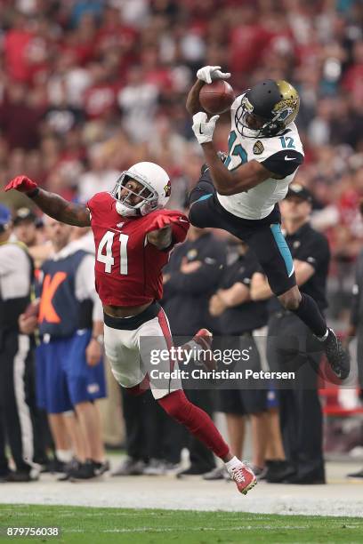 Dede Westbrook of the Jacksonville Jaguars is unable to complete the pass against Antoine Bethea of the Arizona Cardinals in the first half at...