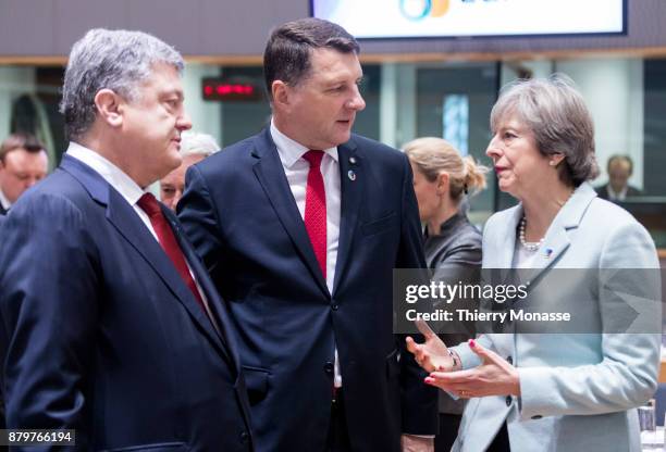 Ukrainian President Petro Oleksiyovych Poroshenko is talking with the Latvian President Raimonds Vejonis and the Prime Minister of the United Kingdom...