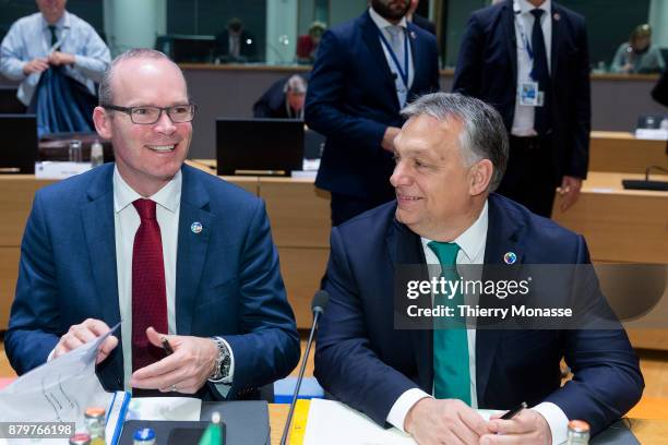 Irish Minister for Foreign Affairs and Trade Simon Anthony Coveney is talking with the Hungarian Prime Minister Viktor Mihaly Orban prior an...