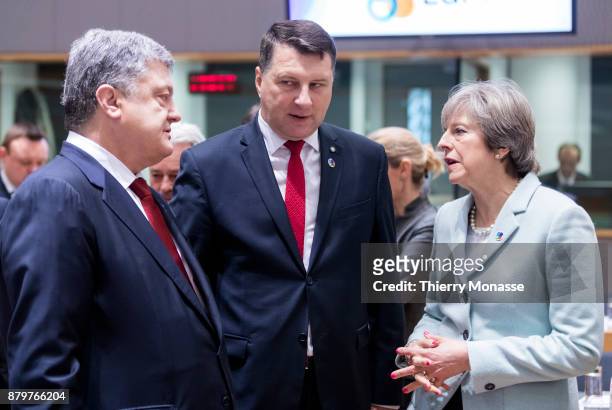 Ukrainian President Petro Oleksiyovych Poroshenko is talking with the Latvian President Raimonds Vejonis and the Prime Minister of the United Kingdom...