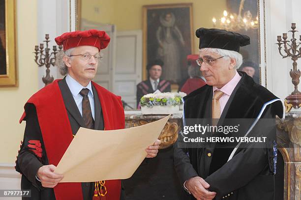 Leuven University rector Marc Vervenne holds a doctor Honoris Causa diploma on May 26, 2009 before awarding it to Palestinian philosophy professor...