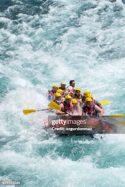 group of people white water rafting - white water rafting stock pictures, royalty-free photos & images