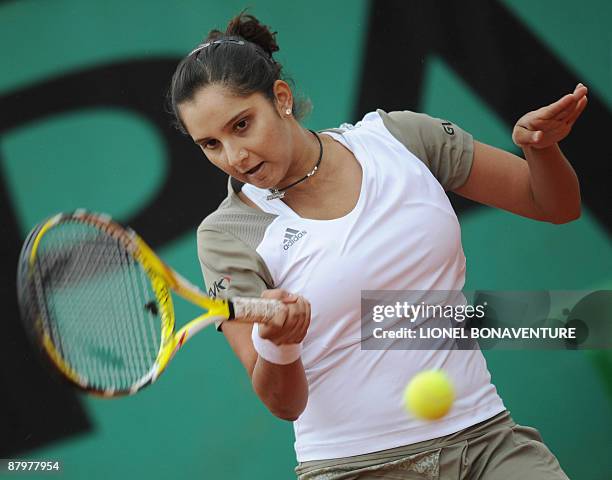 India's Sania Mirza returns a ball to Kazakhstan's Galina Voskoboeva during the French Open tennis second round match on May 26, 2009 at Roland...