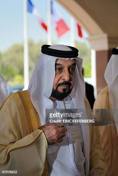 Emirati President Sheikh Khalifa bin Zayed al-Nahayan is pictured as he welcomes French President Nicolas Sarkozy at Al-Mushrif presidential palace...