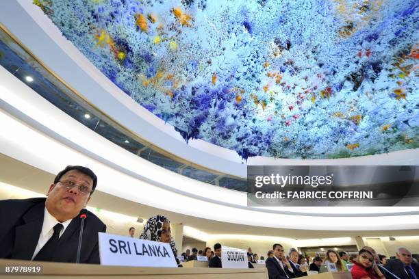 Sri Lanka's Cabinet Minister of Disaster Management and Human Rights Mahinda Samarasinghe gives a speech at the United Nations Human Rights Council...