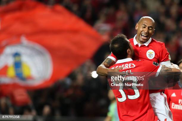 Benfica's defender Luisao celebrates with Benfica's defender Jardel Vieira after scoring during the Portuguese League football match between SL...