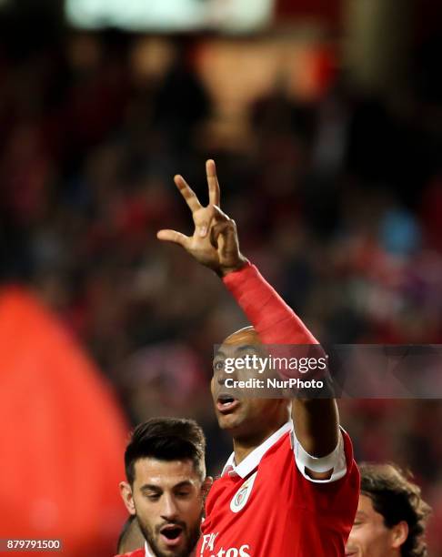 Benfica's defender Luisao celebrates with Benfica's defender Andre Almeida after scoring during the Portuguese League football match between SL...