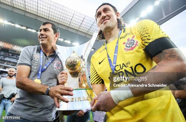 Fabio Carille and Cassio of Corinthians celebrate with the trophy after Corinthians win the Brasileirao 2017 after the match against Atletico MG for...