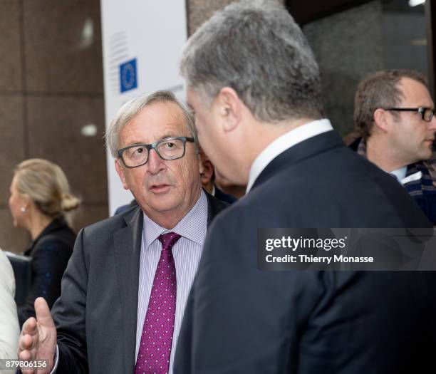 President of the European Union Commission Jean-Claude Juncker is talking with the Ukrainian President Petro Oleksiyovych Poroshenko at the end of an...