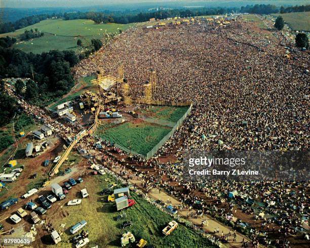 Aerial view taken from a helicopter of the stage and the five hundred thousand strong crowd gathered at the Woodstock Music and Arts Fair in Bethel,...