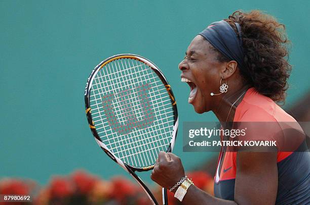 Player Serena Williams celebrates after winning against Czech player Klara Zakopalova at the end of their French Open tennis first round match...