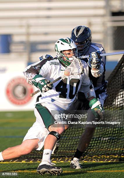 Matt Danowski of the Long Island Lizards carries the ball around the net during a Major League Lacrosse game against the Washington Bayhawks at...