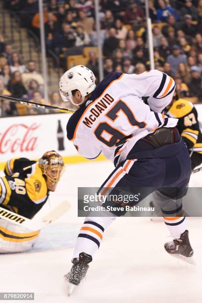 Connor McDavid of the Edmonton Oilers shoots the puck against Tuukka Rask of the Boston Bruins at the TD Garden on November 26, 2017 in Boston,...