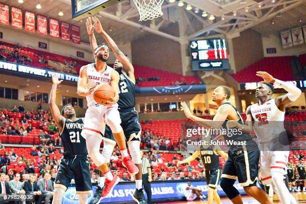 Brandone Francis of the Texas Tech Red Raiders goes to the basket against Dishon Lowery of the Wofford Terriers during the game on November 22, 2017...