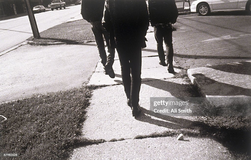 Men walking on sidewalk