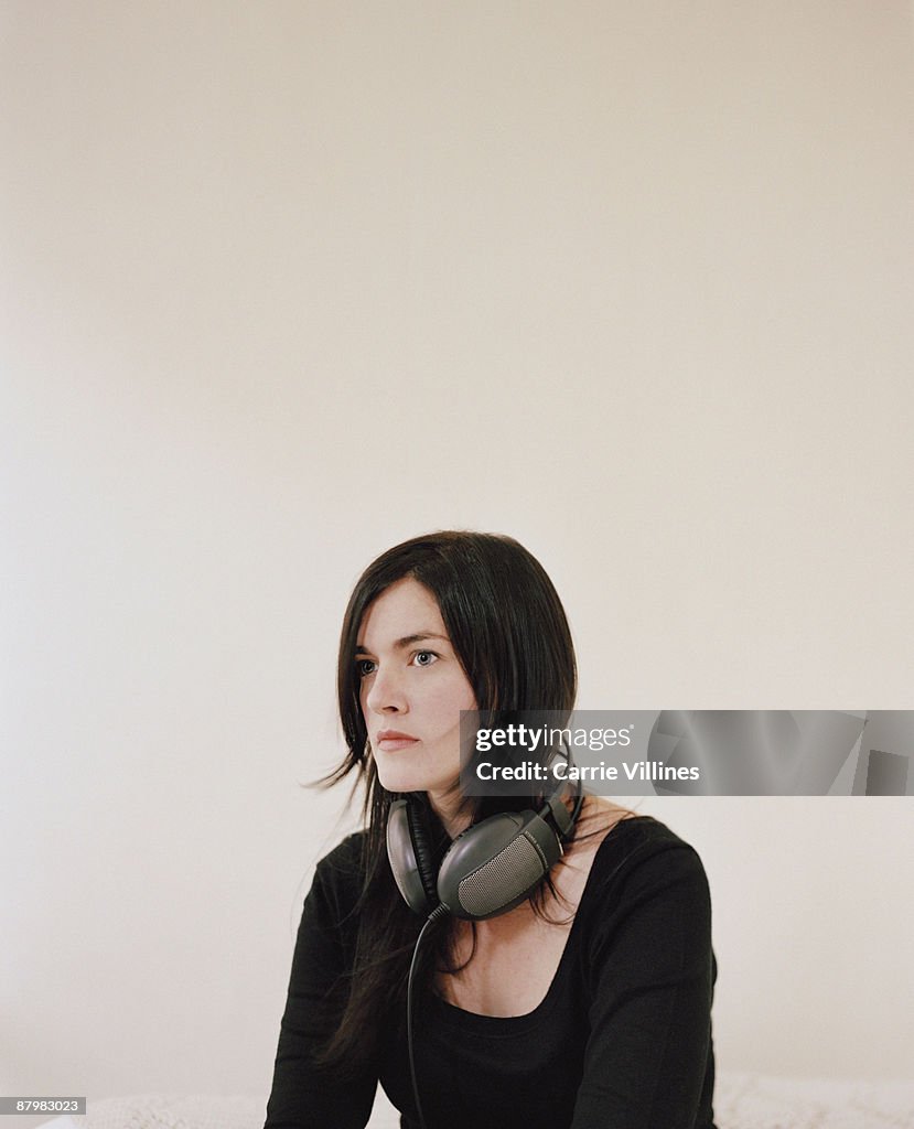 Serious woman with headphones