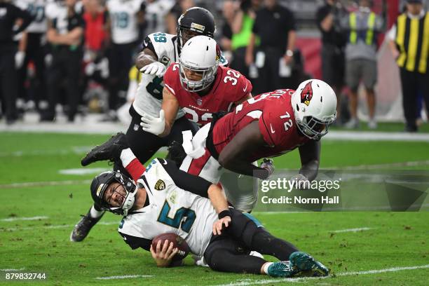 Blake Bortles of the Jacksonville Jaguars is sacked by Olsen Pierre and Tyrann Mathieu of the Arizona Cardinals in the first half at University of...