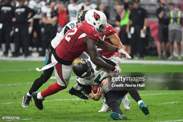 Blake Bortles of the Jacksonville Jaguars is sacked by Olsen Pierre and Tyrann Mathieu of the Arizona Cardinals in the first half at University of...