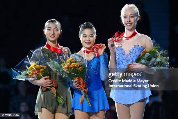 From left, silver medalist Kaori Sakamoto of Japan, gold medalist Satoko Miyahara of Japan, and bronze medalist Bradie Tennell of the United States...