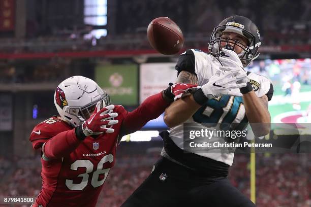 James O'Shaughnessy of the Jacksonville Jaguars is unable to complete the pass against Budda Baker of the Arizona Cardinals in the second half at...