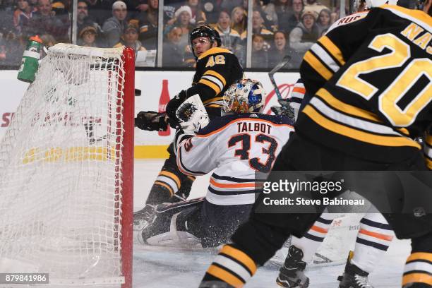 David Krejci of the Boston Bruins watches the puck go in the net for a goal against Cam Talbot of the Edmonton Oilers at the TD Garden on November...