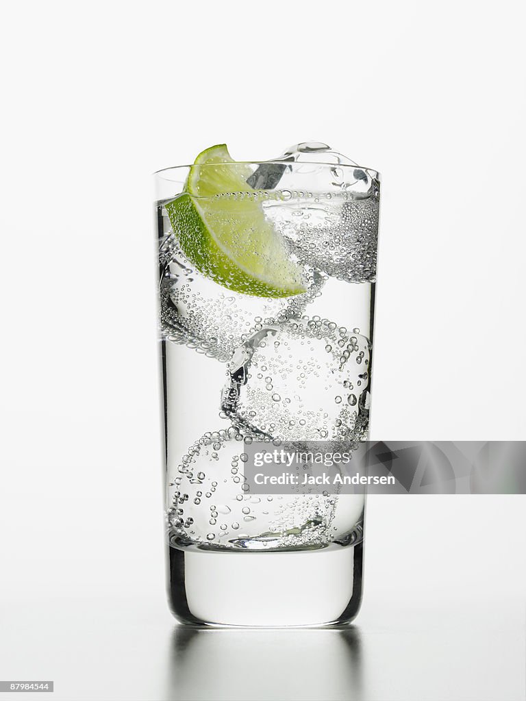 Seltzer water with lime wedge